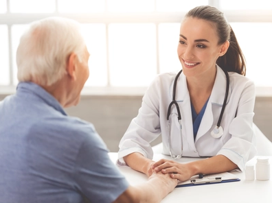 Doctor in a White Medical Coat Ensuring Accurate Patient Care