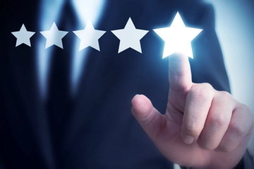 Businessman Touching a Five-Star Review to Increase the Company's Rating