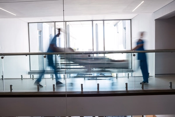 Medical Team Transporting Woman to the Operating Room