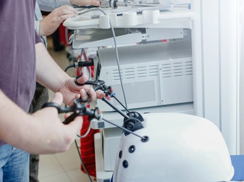 Former Surgical Students with Robotic Simulator