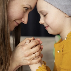 A Mother Spends Time with her Child During Pediatric Therapy and Cobotics Surgery Treatment