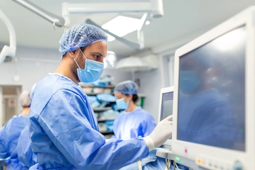 Medical Ventilator Monitored by Anesthesiologist and Assistant Surgeon in the Operating Room