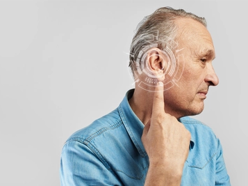 Side View of Man Experiencing Hearing Problems